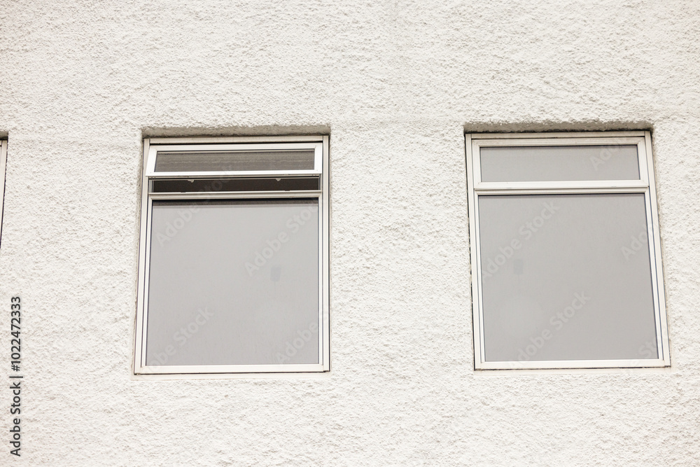 Real modern house window frame isolated on white wall Real modern house window frame isolated on white wall