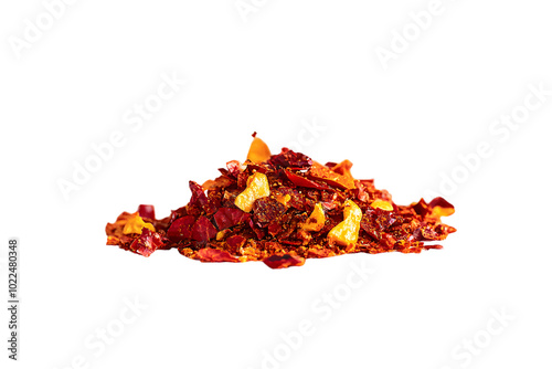 Close up spicy chili red pepper flakes, chopped, milled dry paprika pile isolated on white