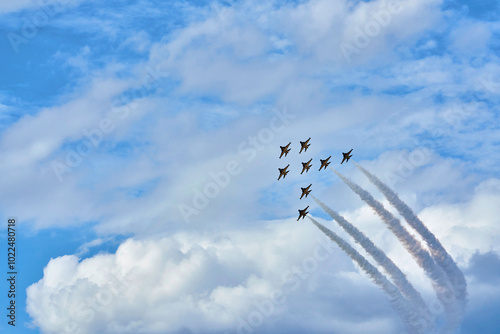 Seoul Air Show, Seoul Airport, Seongnam-si, Gyeonggi-do, Korea - October 18, 2019: T-50 jets perform aerobatics in the sky. Korean Air Forces's 239th Aerobatic Flight Squadron is called 'Black Eagles' photo