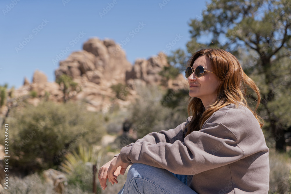 Woman exploring Joshua Tree, National park in California Woman exploring Joshua Tree, National park in California