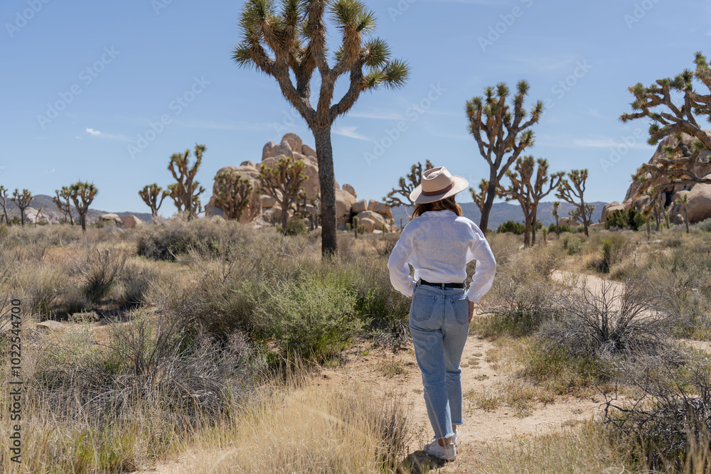 Woman exploring Joshua Tree, National park in California Woman exploring Joshua Tree, National park in California