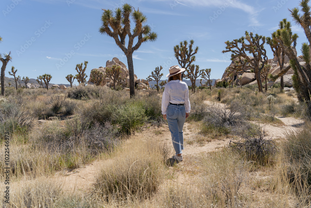 Woman exploring Joshua Tree, National park in California Woman exploring Joshua Tree, National park in California
