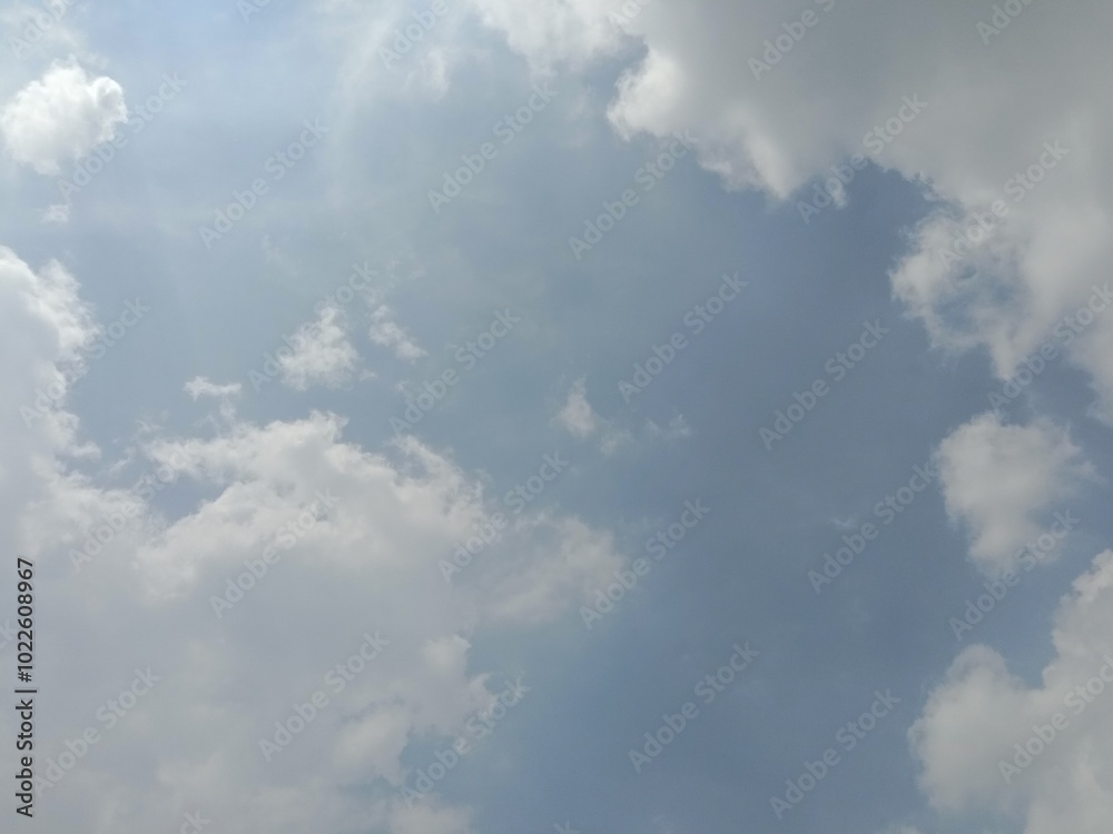 Fototapeta premium Grey clouds on blue sky in daytime. Cloud background. Presentation.