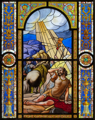 VOGHERA, ITALY - SEPTEMBER 12, 2024: The Conversion of St. Paul the Apostle in the stained glass of the in Domo - Collegiata di San Lorenzo by Corvaya Bazzi workroom from beginn of 20. cent.