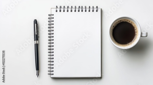 A blank notepad and pen beside a coffee cup, perfect for brainstorming and jotting down ideas in a minimalistic workspace. photo