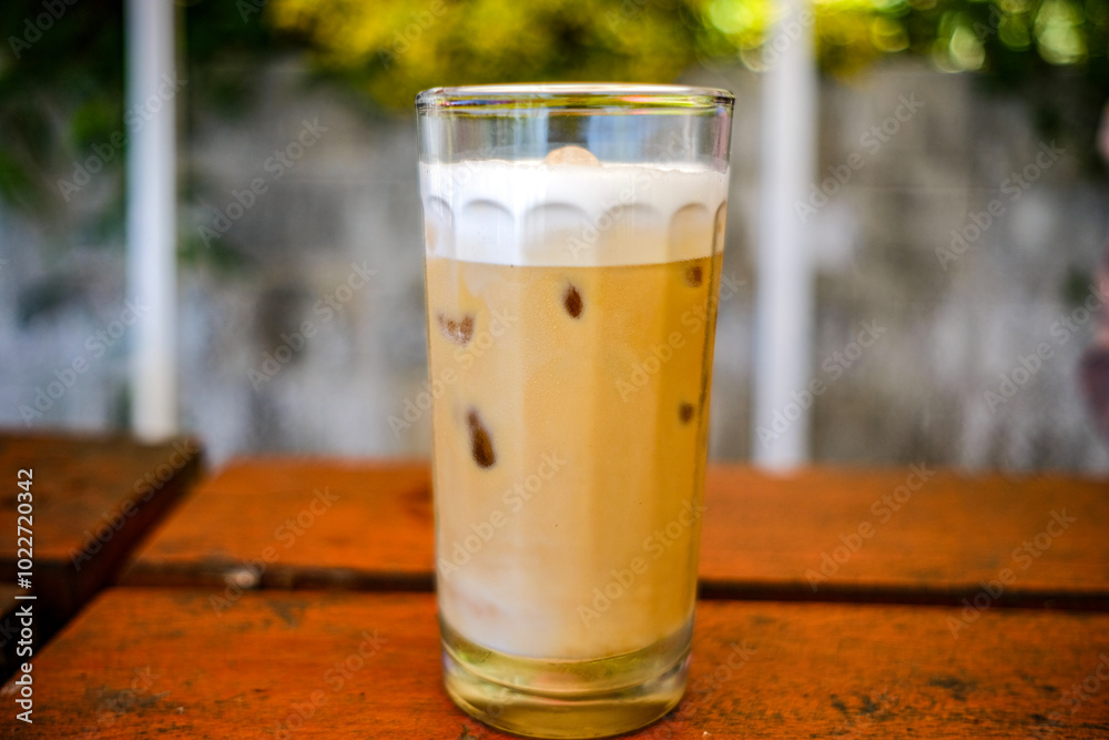 a cup of cold cappuccino iced coffee served in a cafe a cup of cold cappuccino iced coffee served in a cafe
