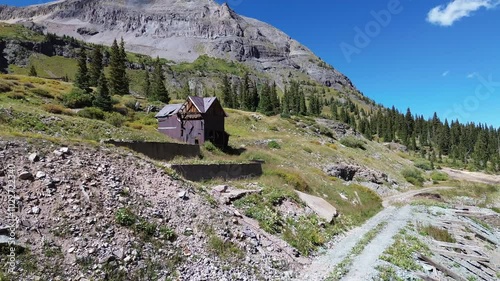 Upper Camp Bird Mine near Ouray, Colorado. Abandoned, idle mine in a high alpine setting is featured in the flyover shot of the area.