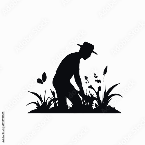 A silhouette of a farmer or gardener working in a field or garden