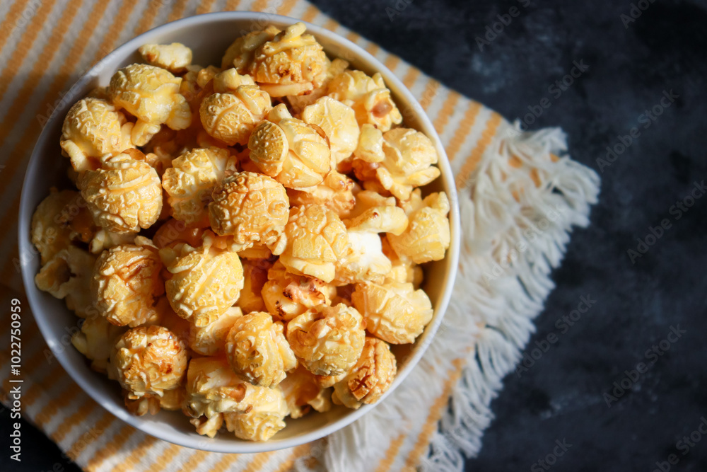 Golden caramel popcorn in top view with copy space. Golden caramel popcorn in top view with copy space.