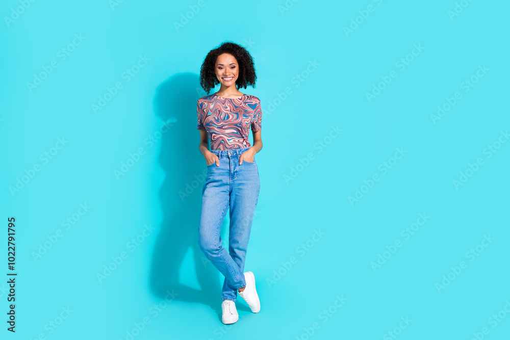 Full body photo of pretty young girl posing model hands pockets wear trendy colorful clothes isolated on aquamarine color background Full body photo of pretty young girl posing model hands pockets wear trendy colorful clothes isolated on aquamarine color background