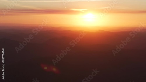 Outback orange yellow vibrant sunset sunrise on mountain layers horizon golden hour Lower Mangrove Hawkesbury River Creek NSW Sydney Blue Mountains Australia aerial drone Spring Summer circle right photo