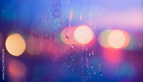 a close-up of rain droplets softly sliding down a fogged window, with blurred city lights in the background and a cool blue tint.