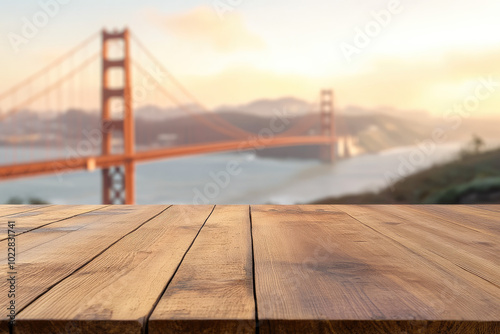 Empty wooden table with a blurred Golden Gate bridge in San Francisco in the background, creating a space for product display or design montage. 