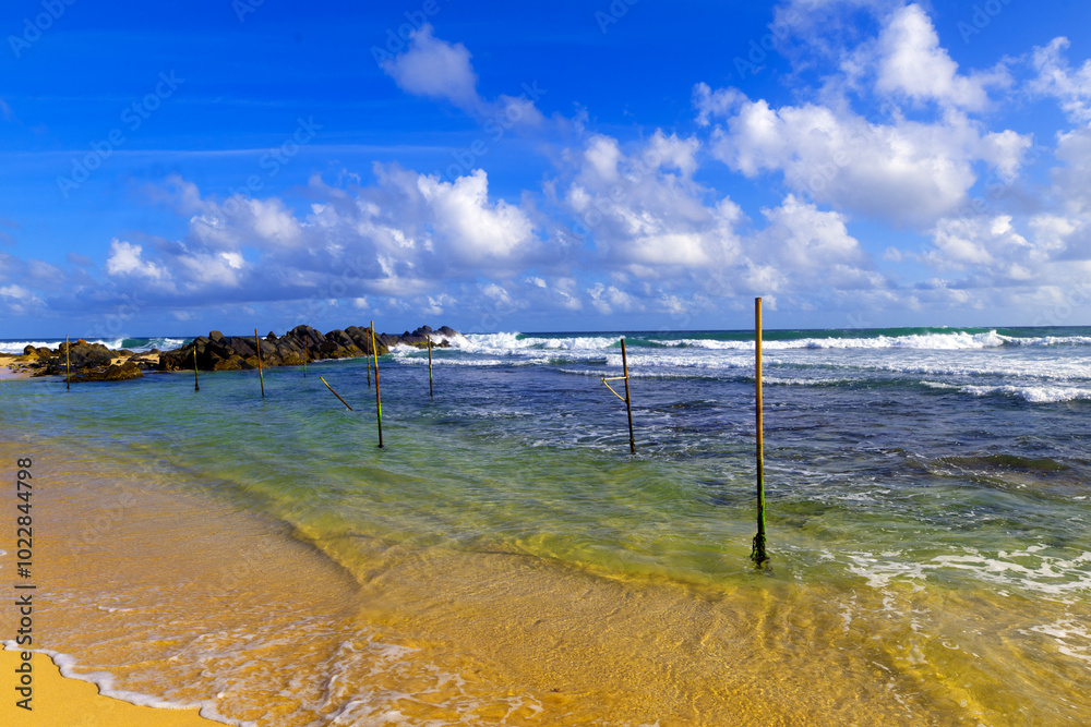 Fishing sticks, on a tropical beach in Galle, Sri Lanka. Fishing sticks, on a tropical beach in Galle, Sri Lanka.
