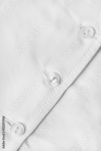 Clothes buttons on fabric photo