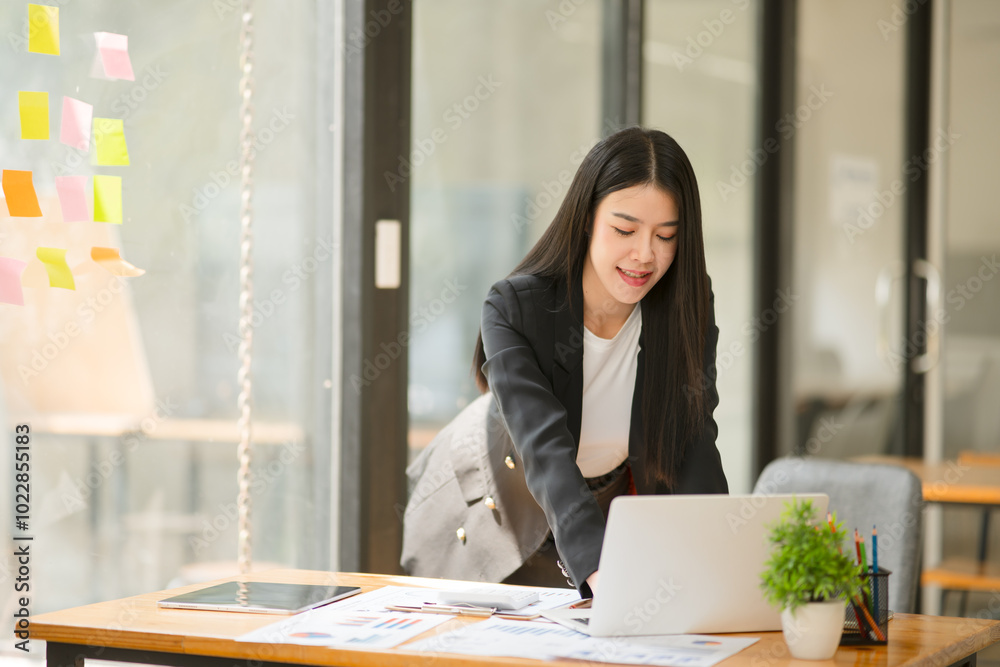 Business woman working on documents, graphs Business woman working on documents, graphs
