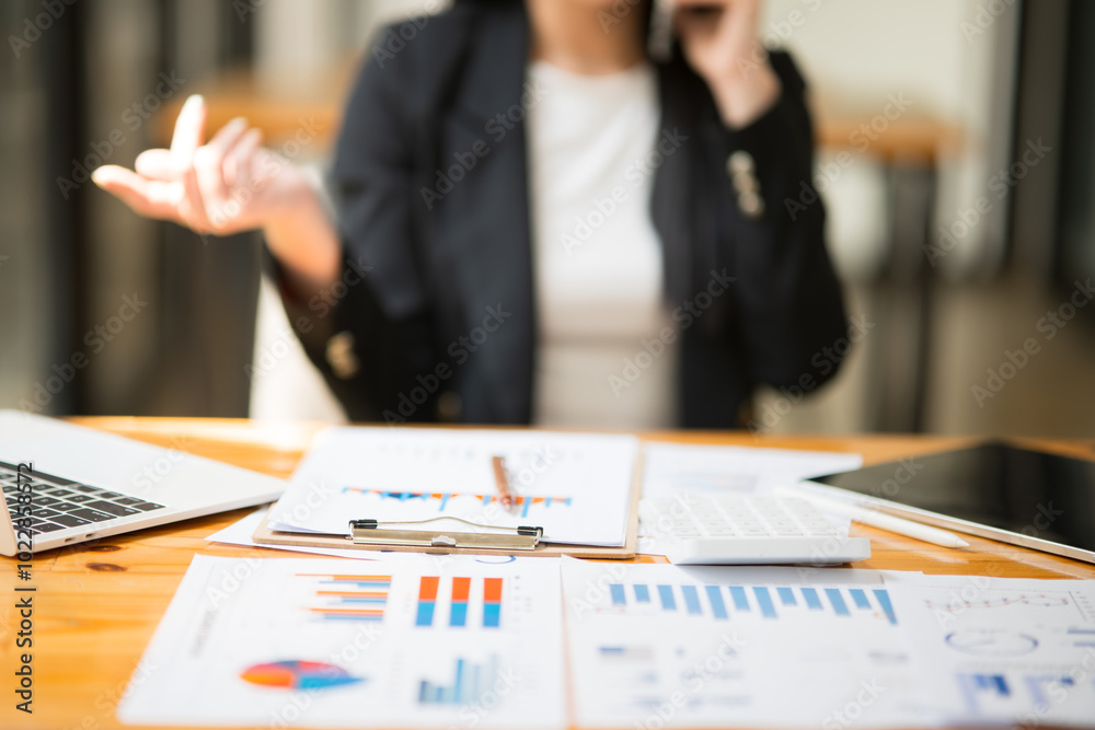 business woman working on documents, graphs business woman working on documents, graphs
