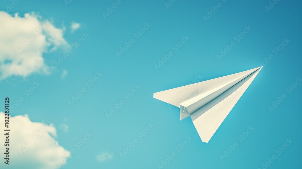 Isolated paper airplane on a clear blue sky background. Isolated paper airplane on a clear blue sky background.