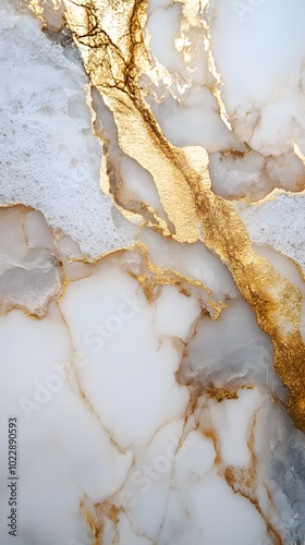 A close-up of white marble with golden veins, showcasing the unique patterns and textures that make it an iconic material for interior design