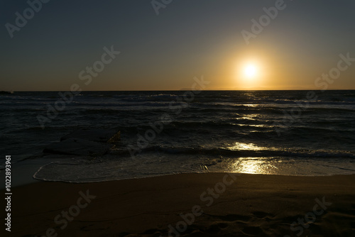 evening sunset in the sea with waves