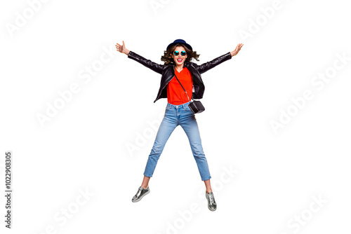 Full size photo of cheerful funny hipster jump enjoy weekends journey wear denim jeans clothes good look isolated over yellow color background photo