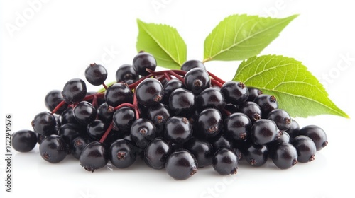 A pile of ripe elderberries with green leaves on a white background.