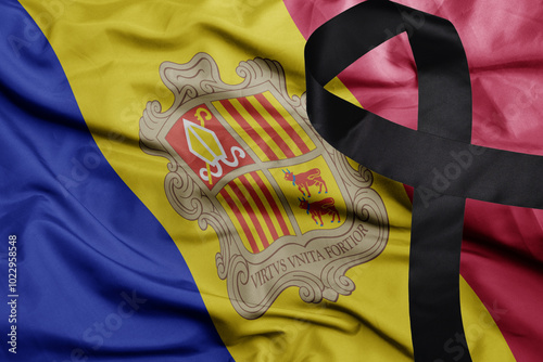 waving national flag of andorra with black mourning ribbon .tragedy concept