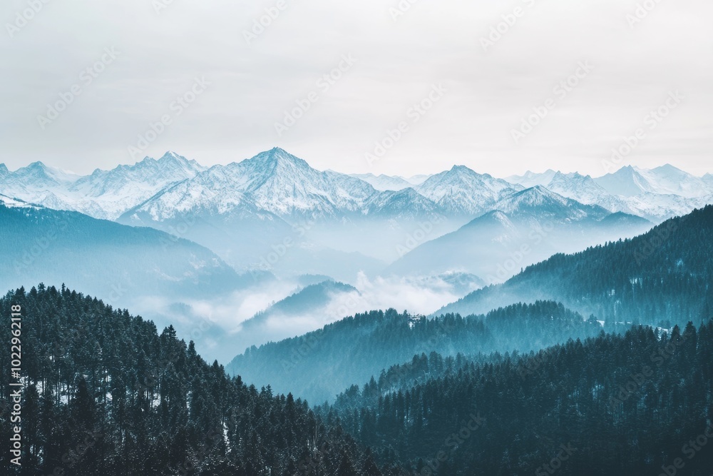 In the winter, clouds and fog cover snowy slopes of the mountains, creating a winter landscape. In the winter, clouds and fog cover snowy slopes of the mountains, creating a winter landscape.