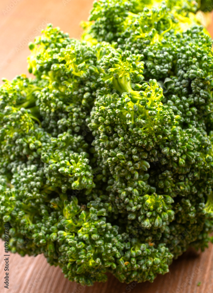 Raw fresh broccoli on old wooden table. Raw fresh broccoli on old wooden table.