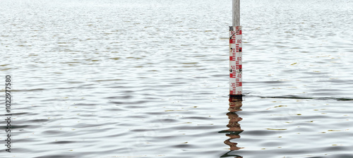 Fotografie Flood monitoring. Water level gauges. Water meter in lake.