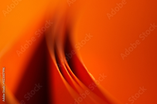 Abstract orange wallpaper. Macro photography paper rolls.