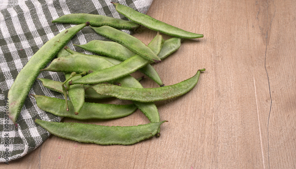 Pile of green beans over wooden background, Healthy food concept Pile of green beans over wooden background, Healthy food concept