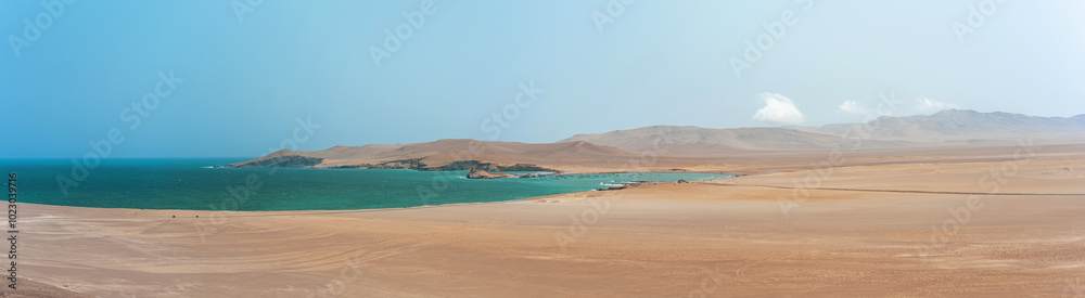 Panoramic view Paracas, Peru, A beautiful beach with a calm ocean and a small island in the distance