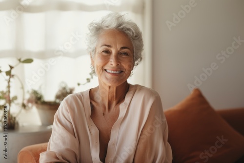 Portrait of a active senior woman smiling in the living room