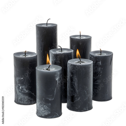 Bunch of black color thick candles on an isolated background photo