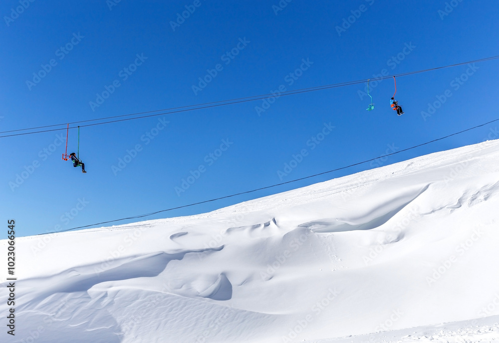 Ski lift in Ski Resort high in the mountains Ski lift in Ski Resort high in the mountains