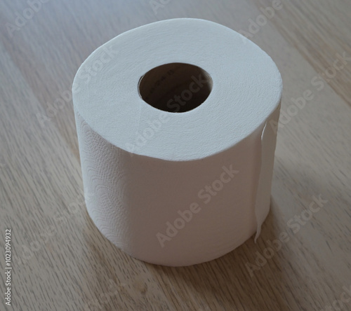 Beautiful close-up of a full roll of toilet paper photo