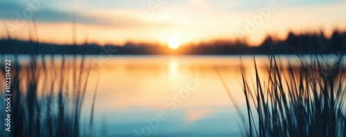 Tranquil sunrise reflection in a calm serene lake with a soft hazy glow symbolizes the beauty and promise of new beginnings  This idyllic peaceful landscape offers a restful photo