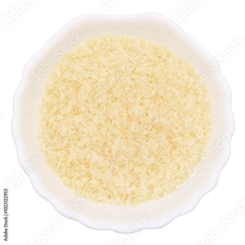 Dry coconut flakes in a round bowl on transparent background. Baking ingredient. Isolated PNG