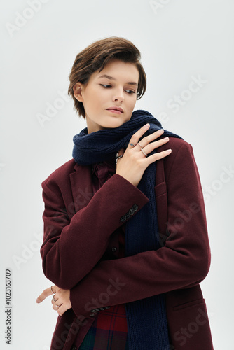 A beautiful woman exudes confidence and warmth, dressed in elegant winter fashion.