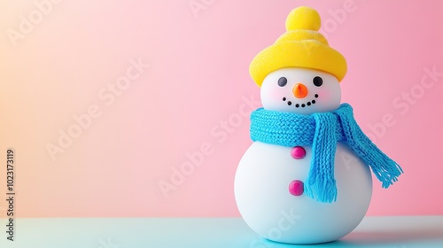 Colorful snowman toy against pink gradient background