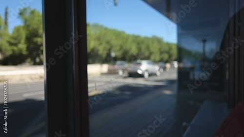 Bus Passes Bus Stop on Blurred Background. Slow Motions. 4K