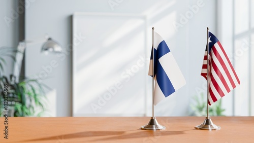 FLAGS OF FINLAND AND LIBERIA ON TABLE photo