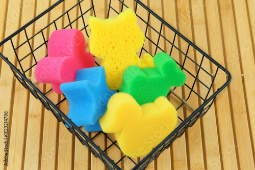 Slika na platnu Baby washcloths in a metal basket on a wooden background