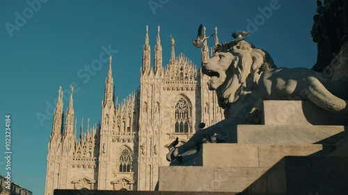 Milan Cathedral, Italy. Lion monument against the backdrop of a beautiful building.