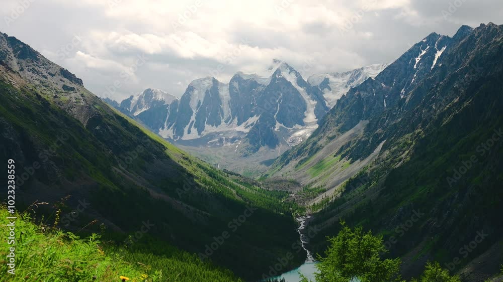 tamlaps, clouds are floating fast over a mountain lake and beautiful mountains in Altai tamlaps, clouds are floating fast over a mountain lake and beautiful mountains in Altai