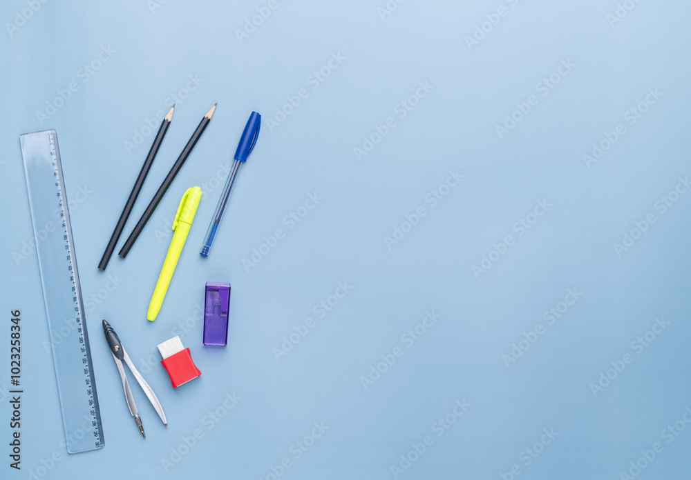 Back to school backdrop. School supply over light blue background