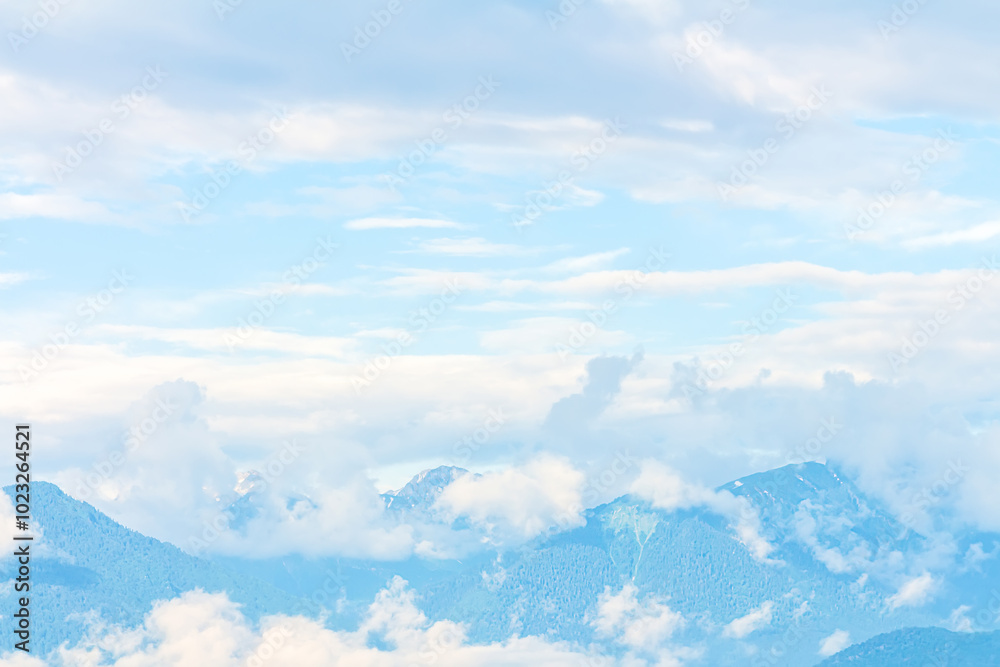 Blurred mountains peak landscape. Blue white mountain nature background wallpaper, soft focus. Blurred mountains peak landscape. Blue white mountain nature background wallpaper, soft focus.