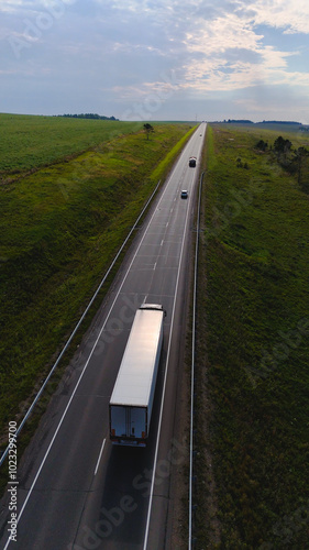 a truck is driving on the road view from a drone