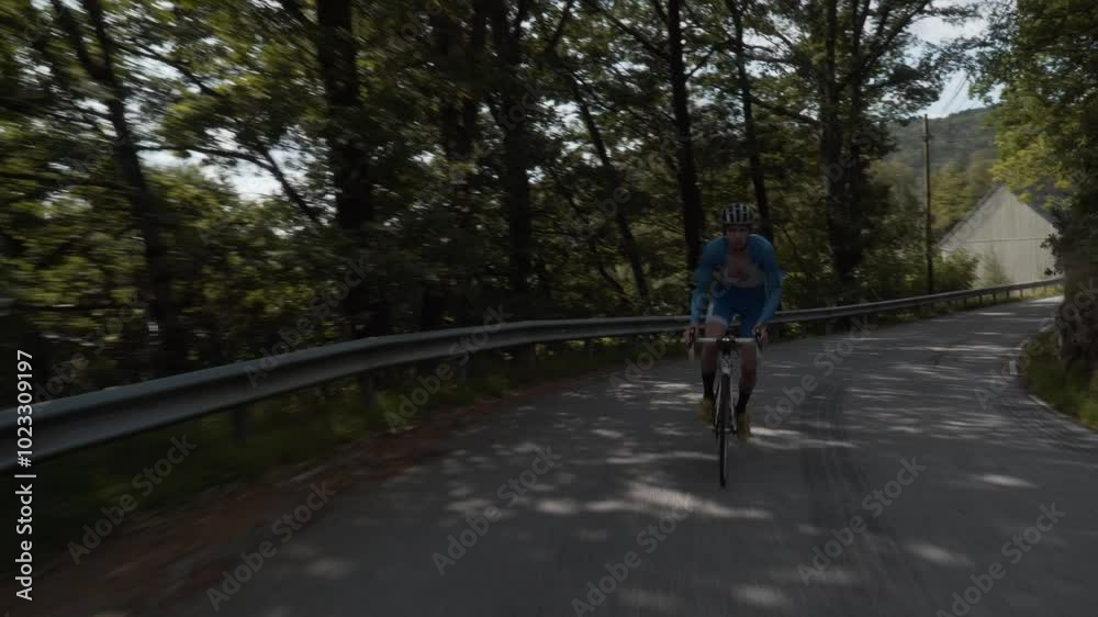 Front-Facing Follow Shot of a Road Cyclist Whizzing Down Empty Roads Amidst Stunning Scenery in Norway Front-Facing Follow Shot of a Road Cyclist Whizzing Down Empty Roads Amidst Stunning Scenery in Norway
